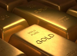 Oro cae por firmeza del dólar, con foco en palabras de Powell en Jackson Hole